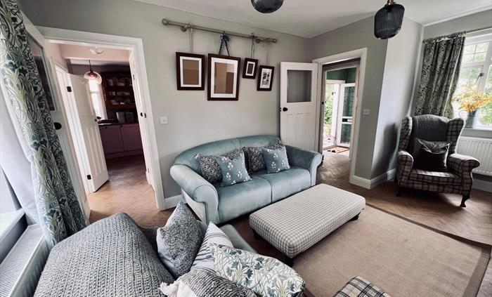 Living room to Kitchen and front entrance